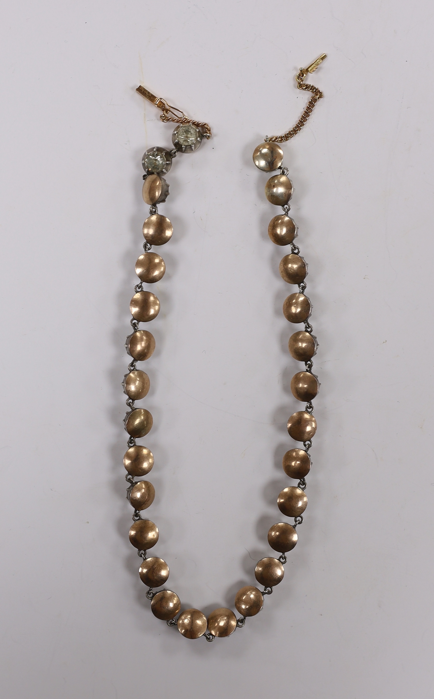 An early 19th century yellow and white metal, foil backed paste set necklace, with later 585 clasp, 32cm.